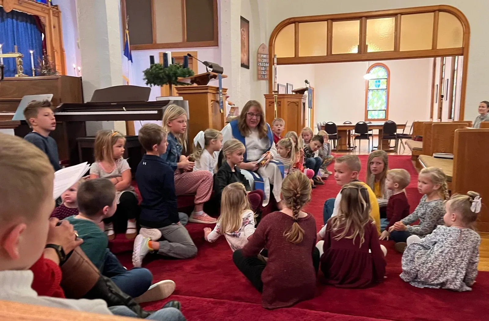 Children gathered together in the church sanctuary